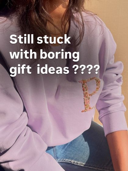 Still stuck with boring gift ideas? A custom floral initial sweatshirt, like this lavender one with a 'P', is a thoughtful and unique solution.