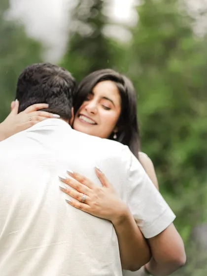 The first hug after "yes". This is the pure, unscripted joy I aim to capture, where you can feel the warmth and relief in their embrace amidst the quiet of the forest.