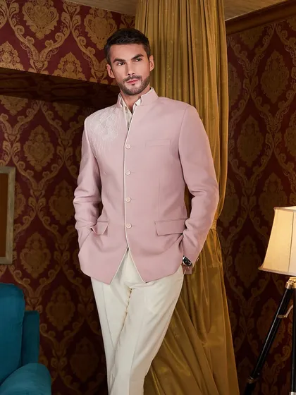The clean lines and perfect fit of this Jodhpuri jacket are evident in this shot. It's a testament to the power of a well-tailored silhouette.