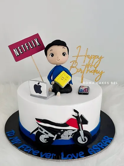 A cake for a bike lover who also enjoys Netflix and his gadgets. This design combines his passions with a detailed fondant motorcycle, a laptop, and a smartphone.