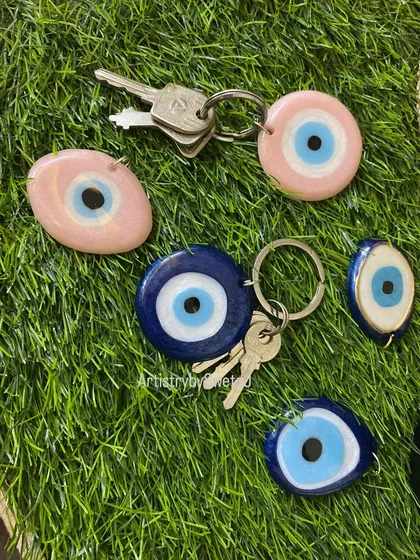 A collection of my evil eye keychains in both pink and blue, perfect for carrying positive energy everywhere you go.