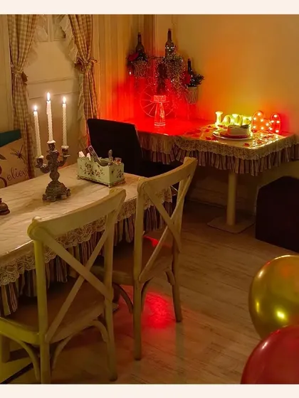 This is one of my favorite setups for a private, romantic dinner. With candlelight, "LOVE" marquee lights, and a table set just for two, it’s a perfect hideaway for an intimate evening.