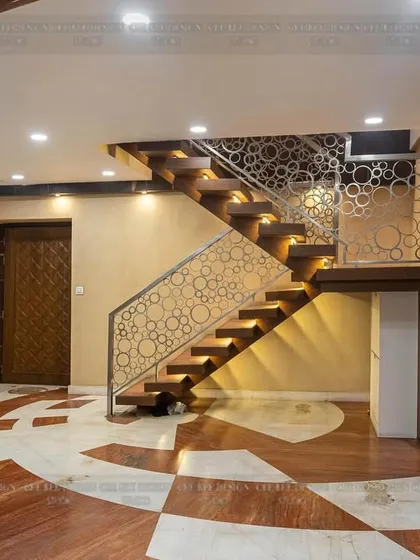 Another angle of the staircase from image 116, showing its dramatic presence in the entryway.