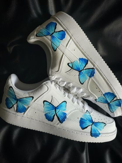 A top-down view of the blue butterfly custom sneakers.