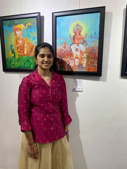 A proud artist stands beside her artwork at the Chitrakar exhibition. This is the platform we provide for our students to showcase their talent.