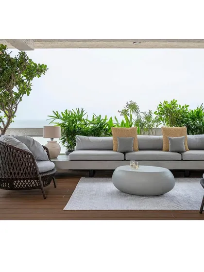 The terrace of Apartment 1600, a bachelor pad overlooking the Arabian Sea. We designed this outdoor space as a seamless extension of the living area, proving that even in a dense urban environment, you can have a luxurious, open-air sanctuary for lounging and entertaining.