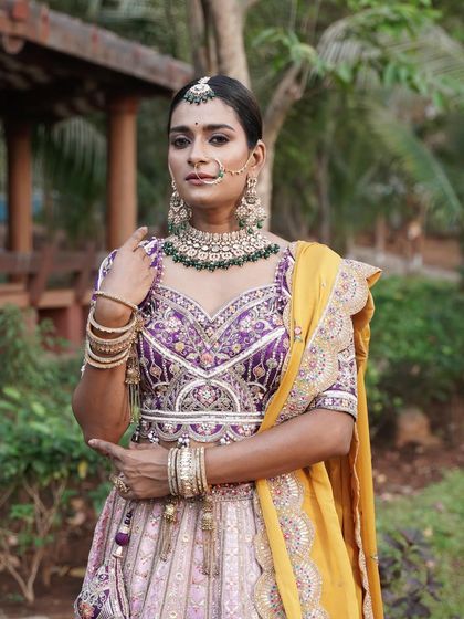 Another beautiful shot of the model in the multi-color lehenga, looking regal and elegant.
