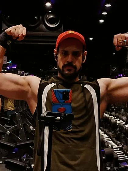 A classic double biceps pose to show arm development. My programs include exercises for both the biceps and triceps to build well-rounded, muscular arms.