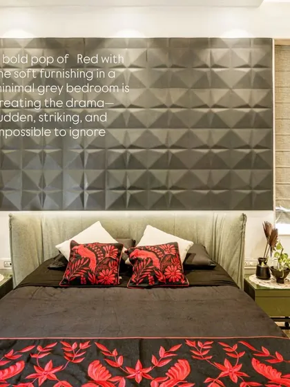 A close-up of the bed from image 13, focusing on the red floral embroidery and textured headboard.
