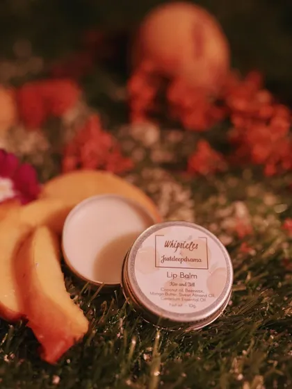 The "Not Your Basic Peach" lip balm, perfect for keeping lips soft and hydrated with a hint of peach.