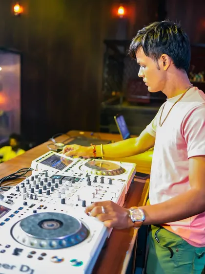 Another focused shot of me mixing, showing my hands on the console.
