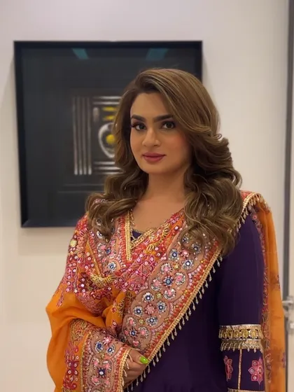 The final Diwali party look, with voluminous waves that perfectly complement the client's colorful and traditional outfit.