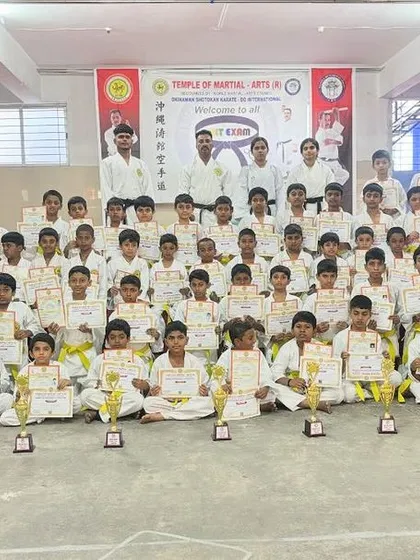 Our dojo is a community. This is a group of our young students after a grading event, proud of their achievements and ready for the next stage of their karate journey.