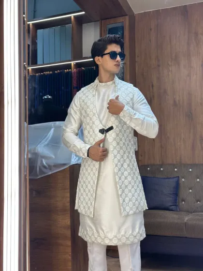 The same white layered kurta set, styled with confidence. The fit is comfortable yet sharp, proving that you don't have to sacrifice style for comfort.