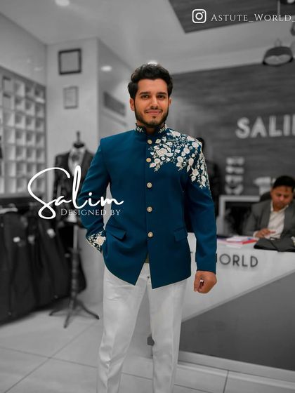 A client wearing a teal Jodhpuri jacket with white floral embroidery on the shoulder and cuff. Paired with white trousers, it creates a fresh and modern ethnic look.