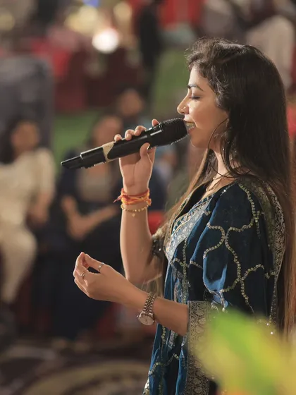 A side profile shot, capturing a moment of deep concentration and emotion during a performance. Every song tells a story, and I strive to convey it with all my heart.