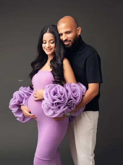 A loving embrace in our pretty lavender Rosa gown. The contrast between the soft purple and the partner's dark turtleneck is just beautiful.