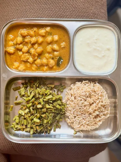A repeat of my simple meal of brown rice, channa masala, sautéed beans, and curd.