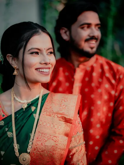A candid shot capturing the bride's radiant smile and the subtle details of her makeup.