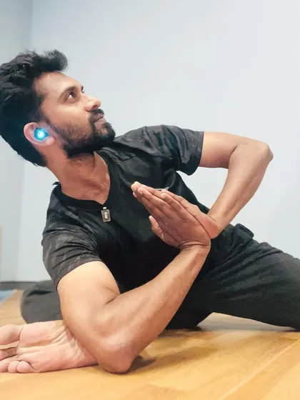 Finding a moment of quiet in a seated twist. This posture, Ardha Matsyendrasana, helps to detoxify the body and calm the nervous system.