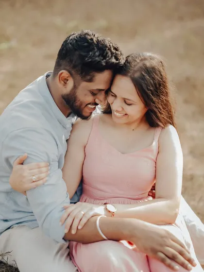 Laughter and joy captured in a close-up. This photo, taken away from the water in a grassy area, shows the variety of backdrops available even during a beach session.
