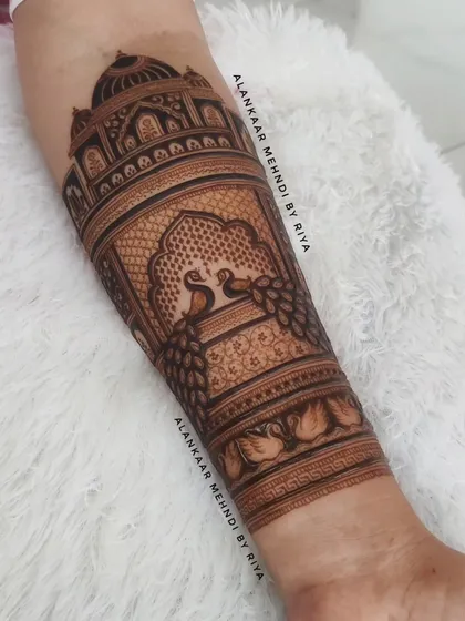 Learn to create breathtaking architectural designs like this intricate Taj Mahal piece. I'll guide you through the techniques for achieving clean lines, detailed patterns, and perfect symmetry in your bridal henna work.