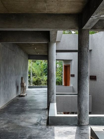 A view through the layered structure of Anahaspa, where the architecture creates a series of frames that capture different aspects of the verdant site.