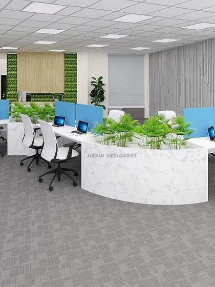 A productive workspace starts with smart design. For this office, we created an open-plan layout with ergonomic seating, low-profile partitions for privacy, and a central planter to bring a touch of nature indoors, fostering collaboration and well being.