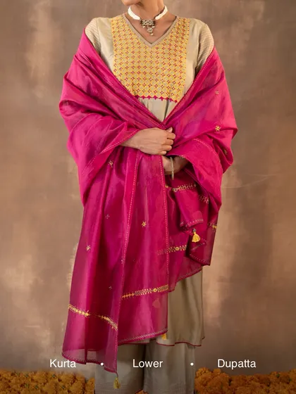 We design complete ensembles that are both elegant and practical. This Ruhani Sage Green Kurta is shown here as a full set, paired with a vibrant pink dupatta and comfortable lowers, creating a sophisticated look for any festive gathering.