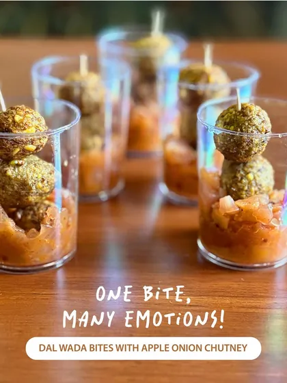 One bite, many emotions. These Dal Wada Bites are a sophisticated version of a classic snack, pairing crispy lentil fritters with a sweet and tangy apple onion chutney, all served in a convenient little cup.