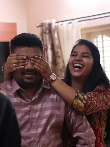 The classic "guess who" moment before a big reveal. The anticipation and laughter are all part of the fun.