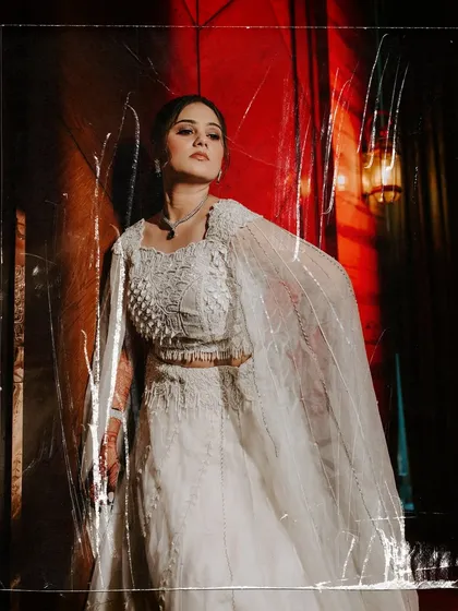 A high-fashion bridal portrait for a Sangeet, using a plastic sheet to create a unique, textured, and edgy look.