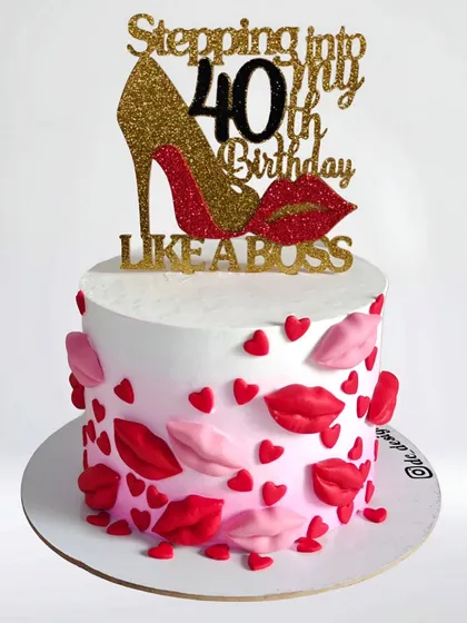 "Stepping into my 40th Birthday like a boss." This glamorous cake features a high heel, lips, and hearts, perfect for a fabulous 40th celebration.