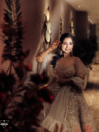 A solo portrait of the bride, her elegant gown and gentle smile captured in warm, flattering light.