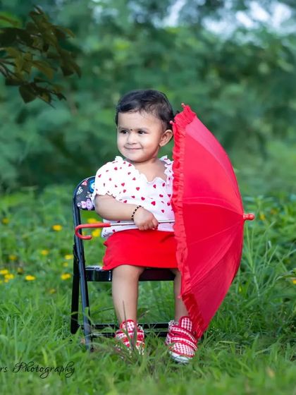 A beautiful smile that could brighten any day. This little girl's joy is infectious, and capturing moments like this in a natural, outdoor setting is what my photography is all about.