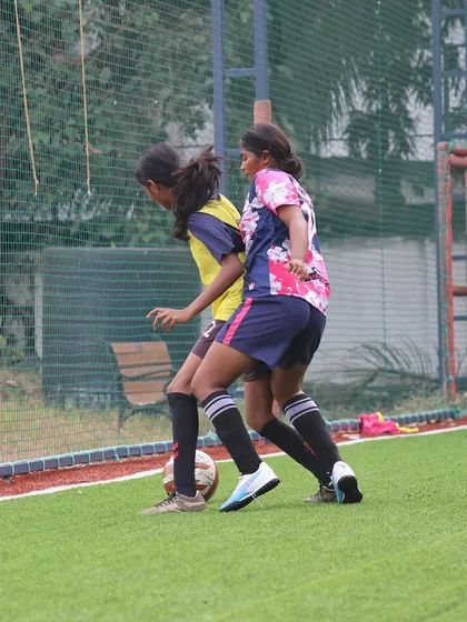 Two of our players working together to win the ball back, showcasing their defensive teamwork and coordination.