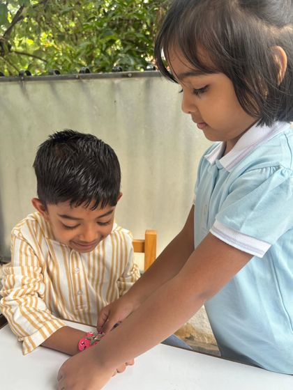 More moments from our Raksha Bandhan celebration, showing children tying rakhis and sharing sweets, learning about mutual care and respect.
