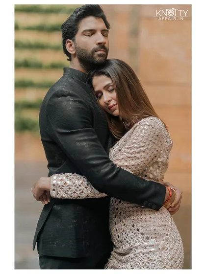 Safe in his arms. This heartfelt embrace between Malvika and Pranav shows the comfort and peace they find in each other. It’s a candid, emotional photograph that captures the essence of their relationship.