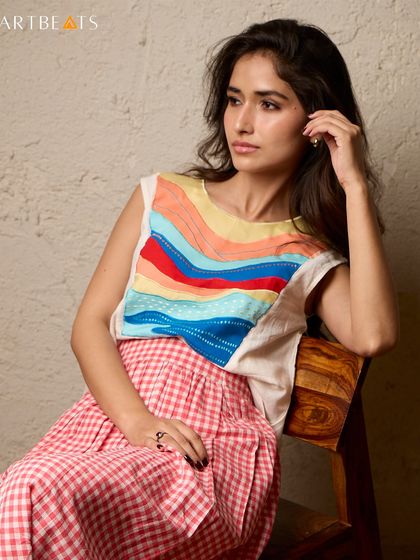 Sunlit mornings by the sea call for the Seascape Co-ord Set. The top features a colorful, wave-like art panel, while the red gingham skirt adds a touch of playful nostalgia.