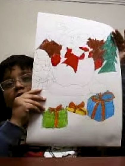 A winter wonderland scene with Santa and presents, drawn by a student during our festive online classes.