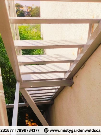 Another perspective of the open-riser staircase, showing the precision of the fabrication. Each step is perfectly aligned and welded for maximum strength and a clean finish.