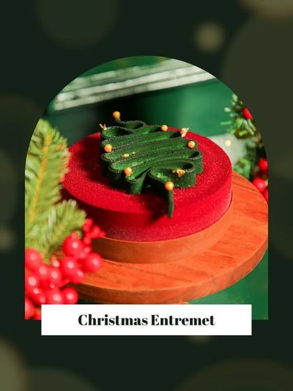 Our Christmas Entremet, shaped like a festive tree on a red velvet base. A merry treat for every taste.