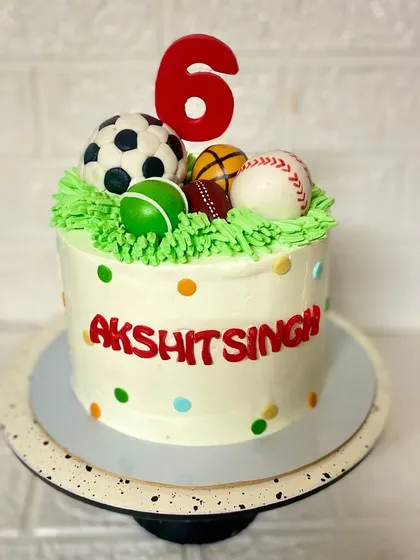 And that's a six. This butterscotch cake is for the little athlete who loves all sports, featuring fondant football, baseball, and more.