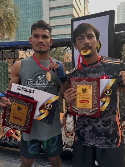 Two of our warriors with their well-earned plaques after the Real Cage Championship. The result of dedication and a "never give up" attitude.