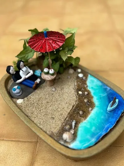 Imagine a peaceful evening by the sea, captured in a tiny tray garden. I create these complete miniature scenes so you can hold a perfect moment in your hands or give it to someone you love.