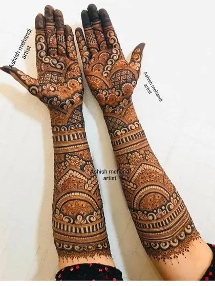 A classic full-arm bridal design with repeating bands of traditional patterns for a rich and textured look.