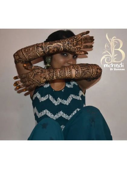 The same happy bride, giving a great view of the full coverage on her arms.