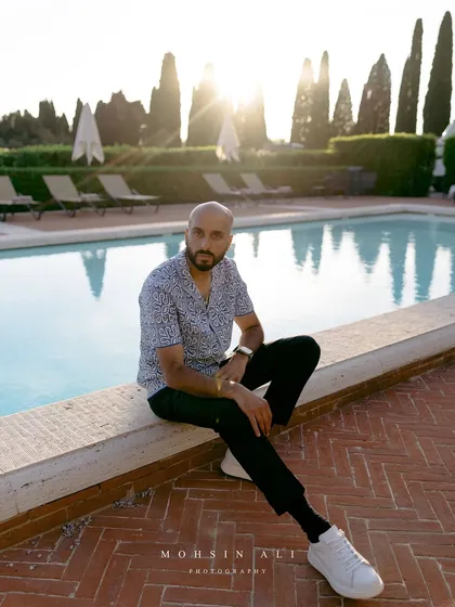 Poolside vibes in Tuscany, Italy. Before the party kicks off, it's about soaking in the incredible surroundings of the venue, a stunning estate surrounded by vineyards.