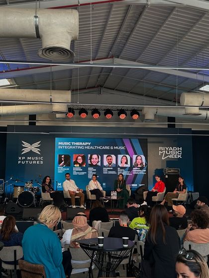 A wide shot of a panel on Music Therapy at the Riyadh conference. The event covers a diverse range of topics, reflecting the multifaceted nature of the modern music industry.