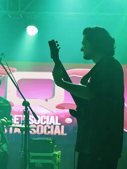 A silhouette of our guitarist against the event's branding. We seamlessly integrate into your event's theme, making our performance a natural extension of your brand.